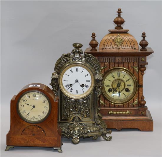 Three mantel clocks, including one oak, one brass and one Swiss tallest 42cm